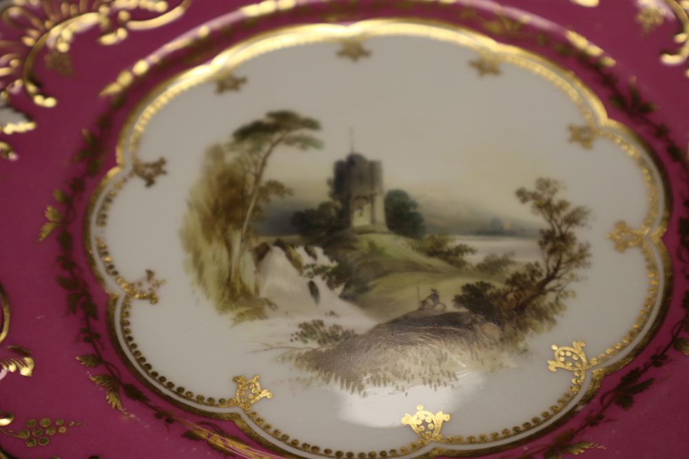 A late 19th century Wedgwood imari pattern plate, two 19th century pink bordered plates, and one other cabinet plate titled View near